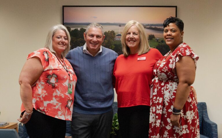 2025 Henrico Christmas Mother Ann McGee stands with County Manager John Vithoulkas and the two organizations of Henrico's Christmas Mother program, Rebecca Slough and Tanya Brackett.