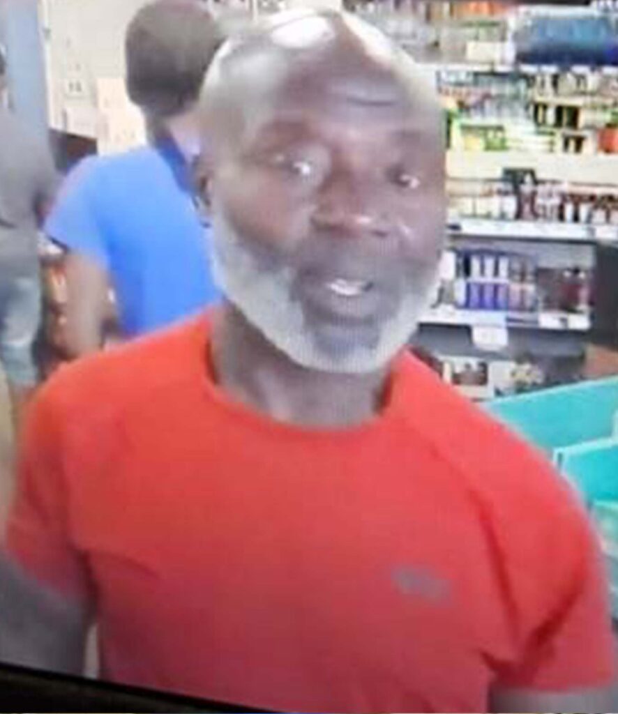 A person wearing a red tshirt in a Virginia ABC Store.