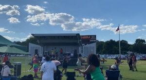 People dancing and performing on the community stage at Juneteenth