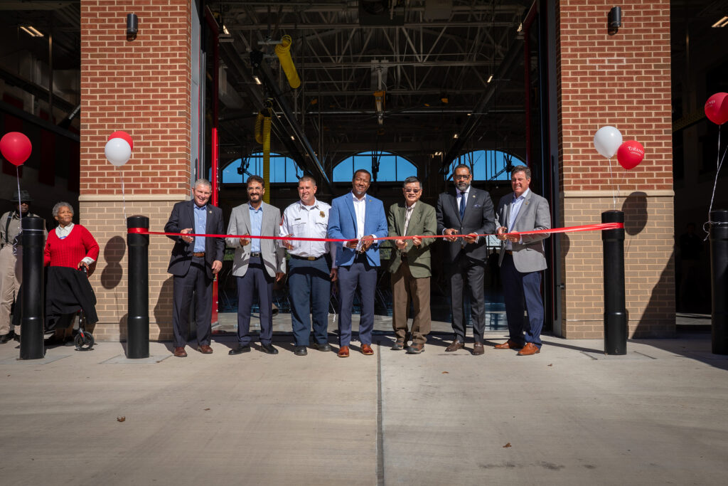Officials prepare to cut the ribbon for Firehouse 23.