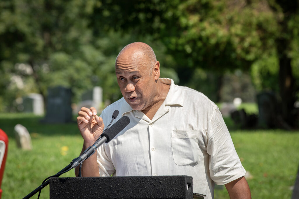 A speaker at a lectern.