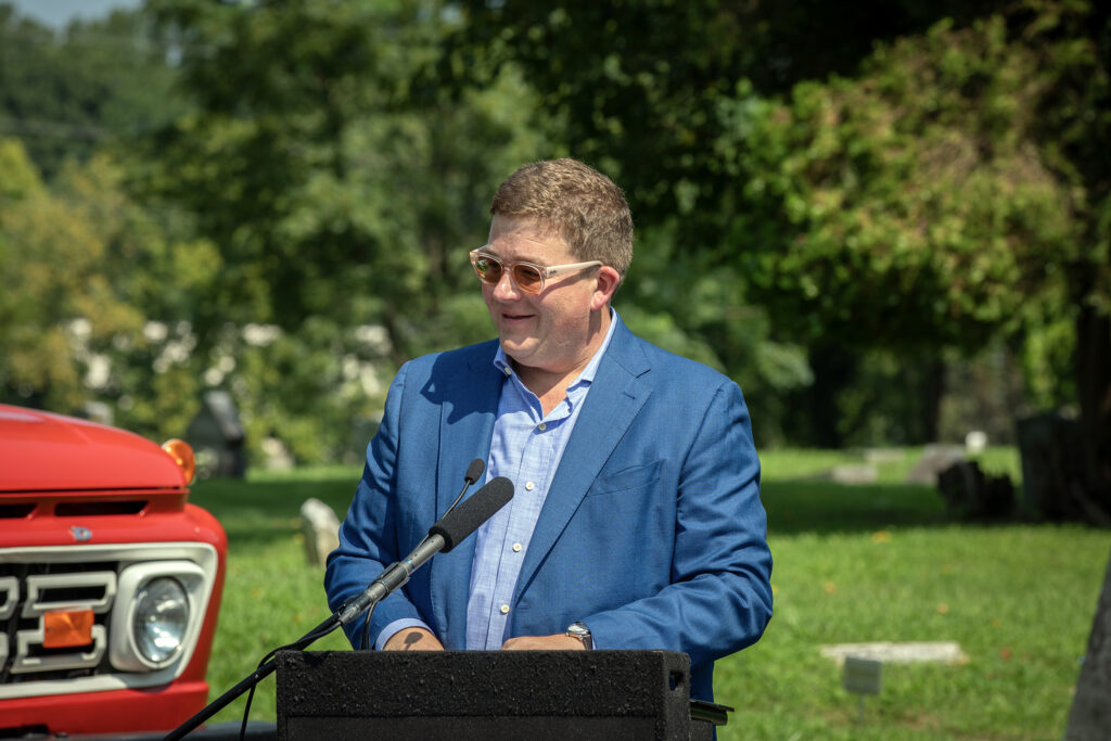 A speaker at a lectern.