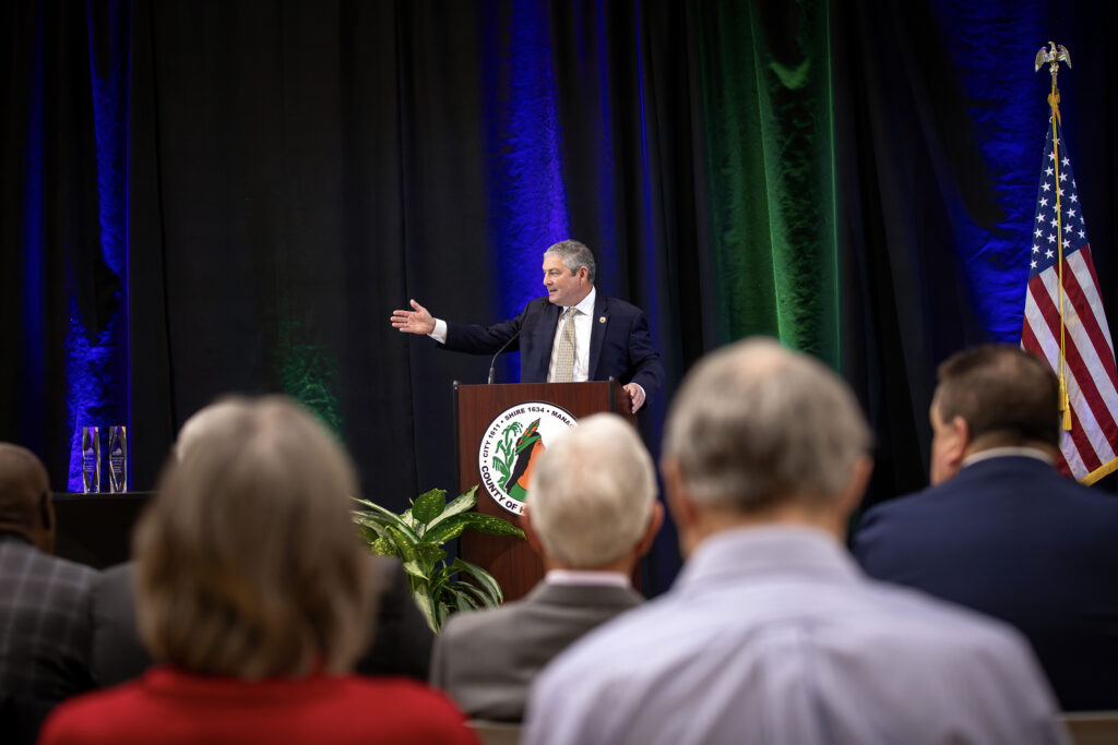 County manager speaks at lectern at State of the County address.