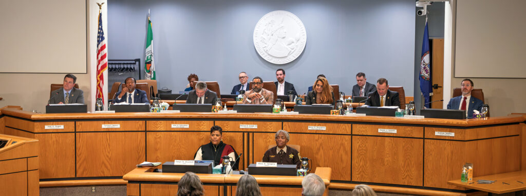 Officials sit at the dais in the county's Board Room.