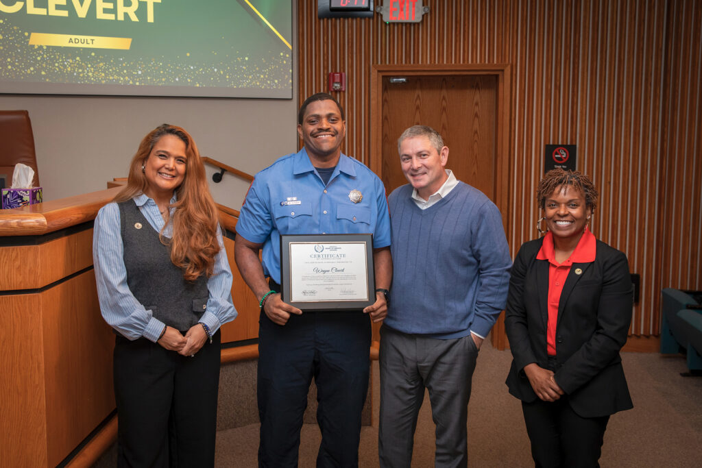 Officials recognize a recipient of the Henrico Heart of Service Awards.