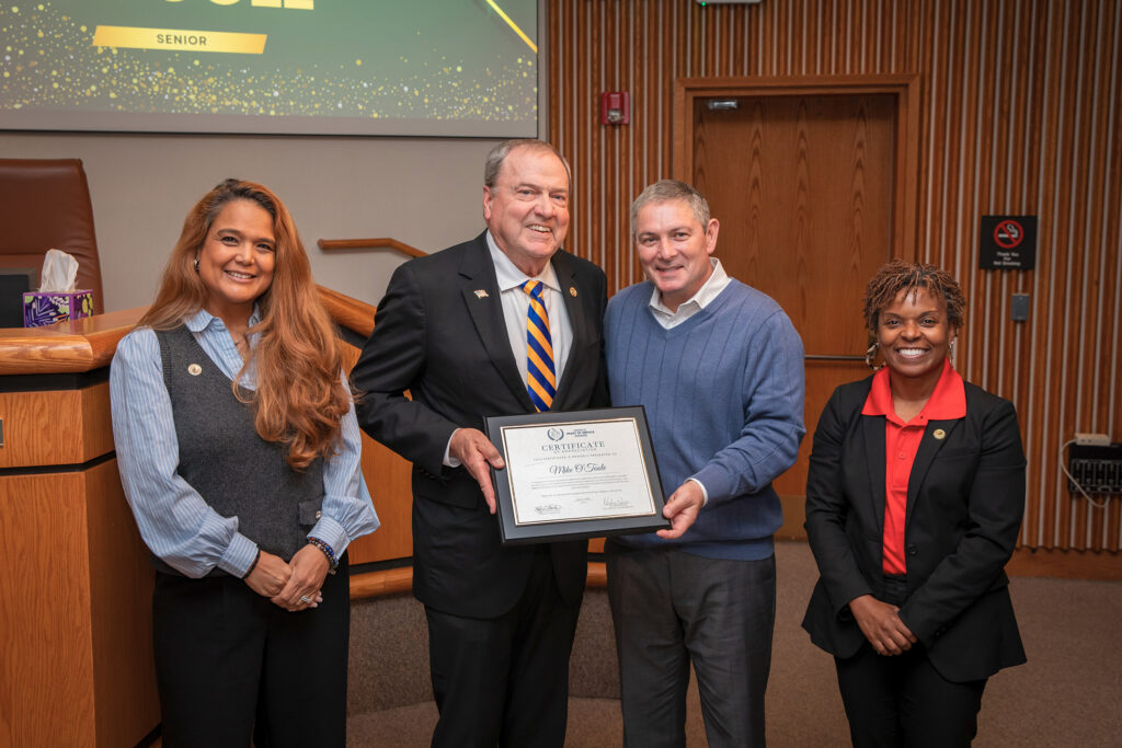 Officials recognize a recipient of the Henrico Heart of Service Awards.