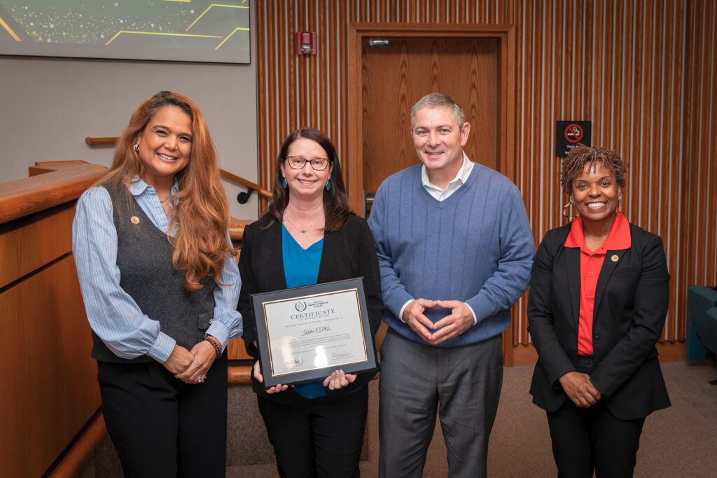 Officials recognize a recipient of the Henrico Heart of Service Awards.