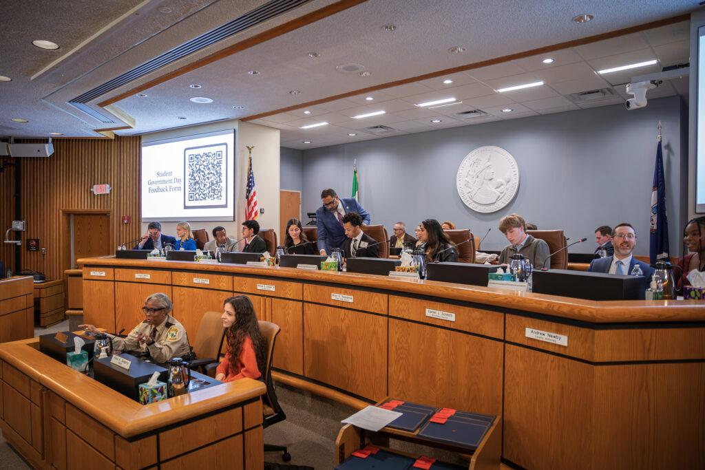 High school students participate in a mock Board of Supervisors meeting for Student Government Day.