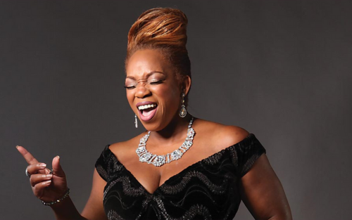 Picture of Desiree Roots singing.