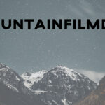 Mountain background with Moutainfilm on Tour text.