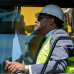 Henrico Supervisor Roscoe D. Cooper III operates an excavator.