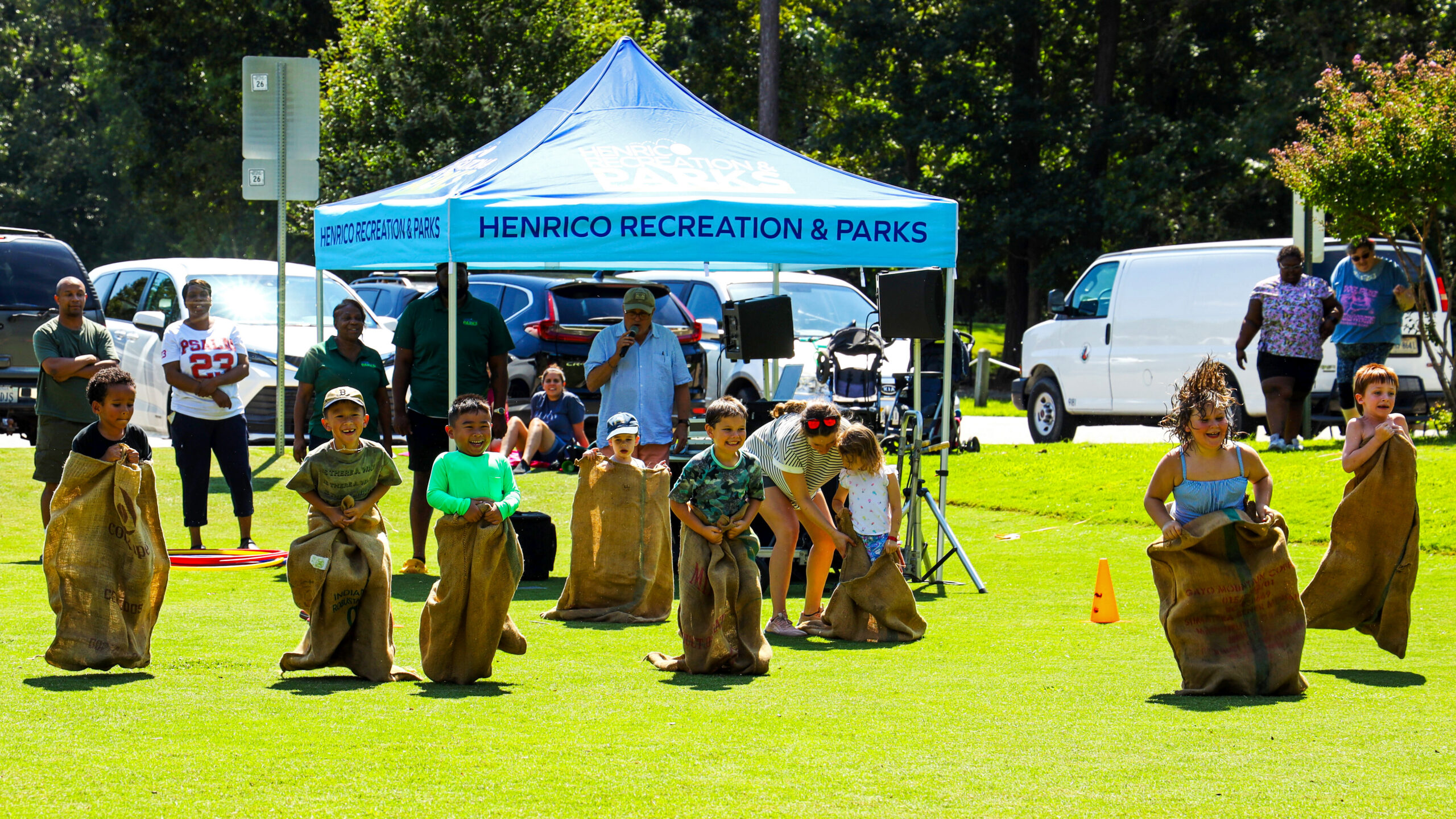 Kids doing a sack race at Beats and Treats event. 