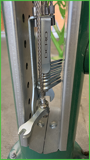 Closeup of tools on a bike repair station.