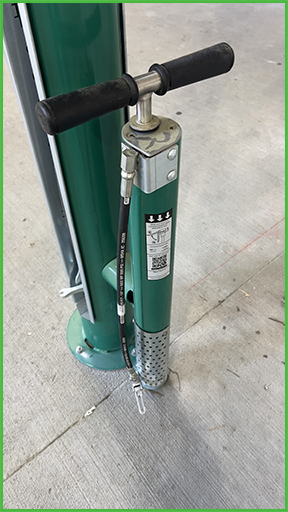 An air pump as part of a bike repair station.