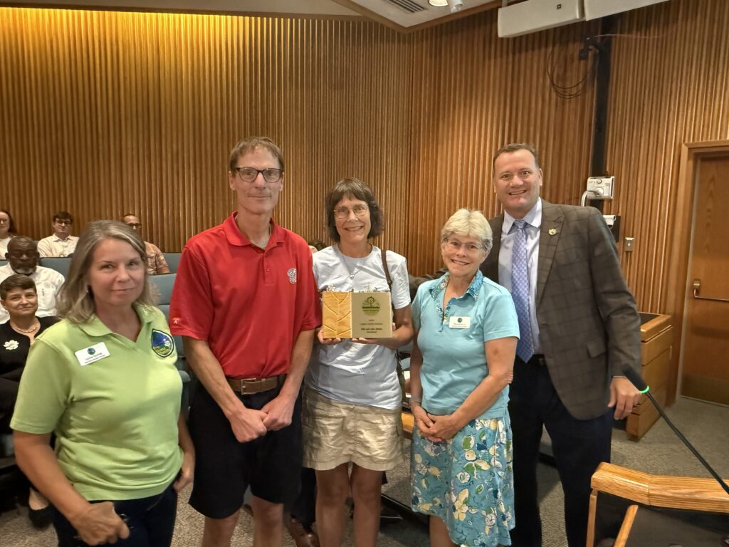 Brookland Supervisor Dan Schmitt is shown with a member of the Keep Henrico Beautiful committee and Lilly and John Weber, who won a 2026 Land Lover award for their property in the Brookland District.