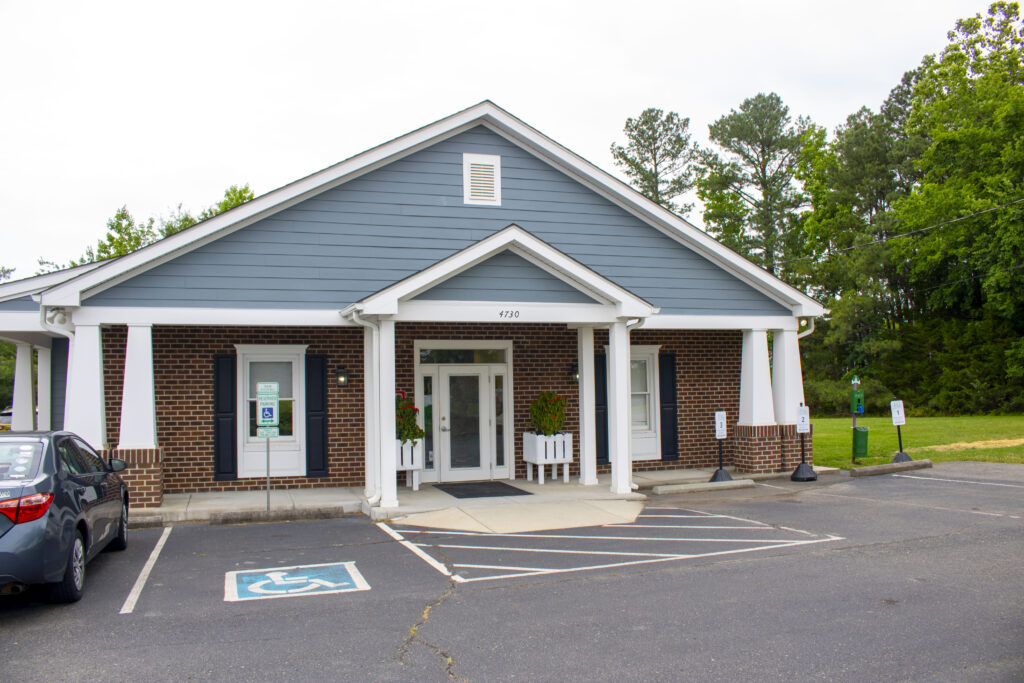 photo of a building with a clean parking lot in front