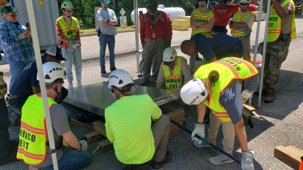 Community emergency response team volunteers cribbing a section of a wall
