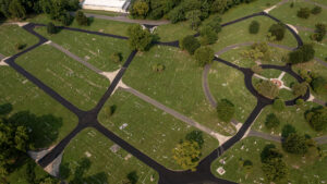 An aerial photo of a cemetery with newly paved roads.
