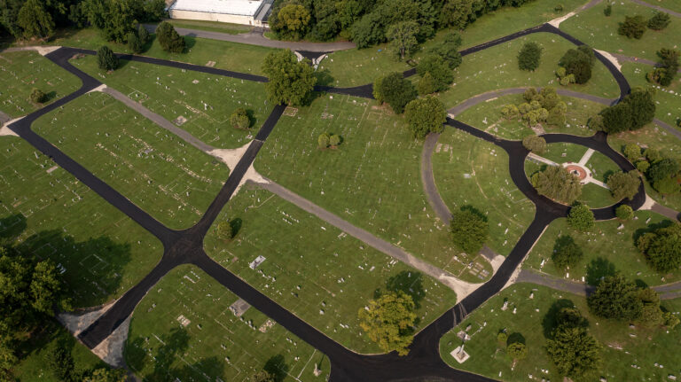 An aerial photo of a cemetery with newly paved roads.