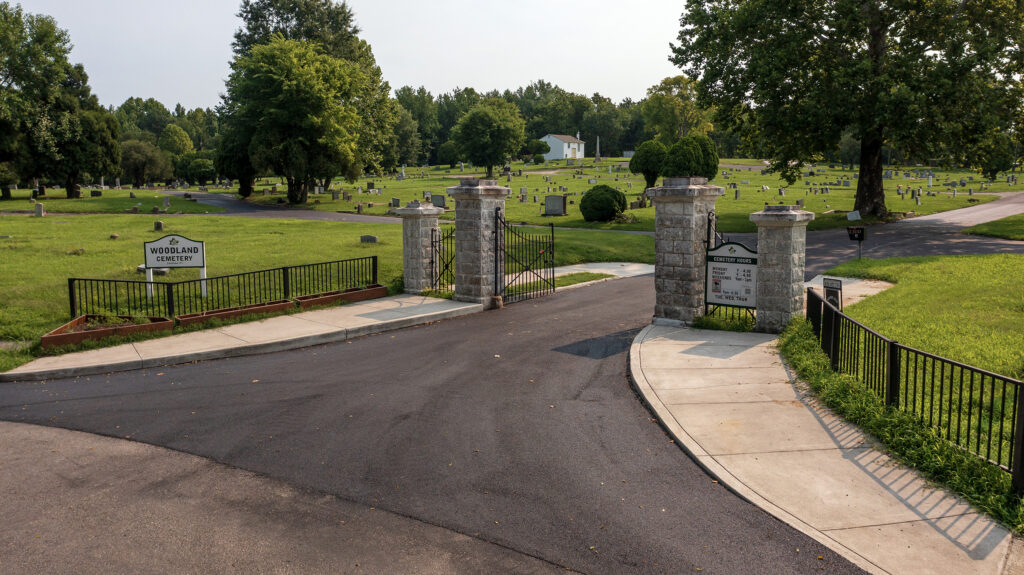 A repaved entrance to a cemetery.