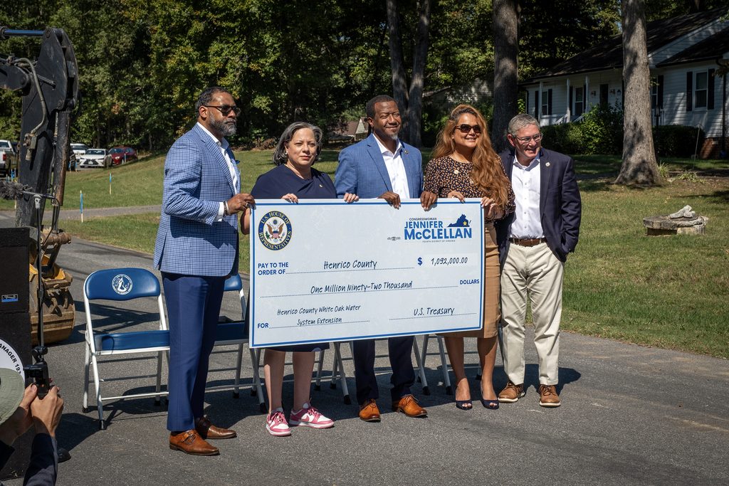 Roscoe Cooper, Jennifer McClellan, Tyrone Nelson, Misty Roundtree and John Vithoulkas post with the large cardboard check for $1,092,000.