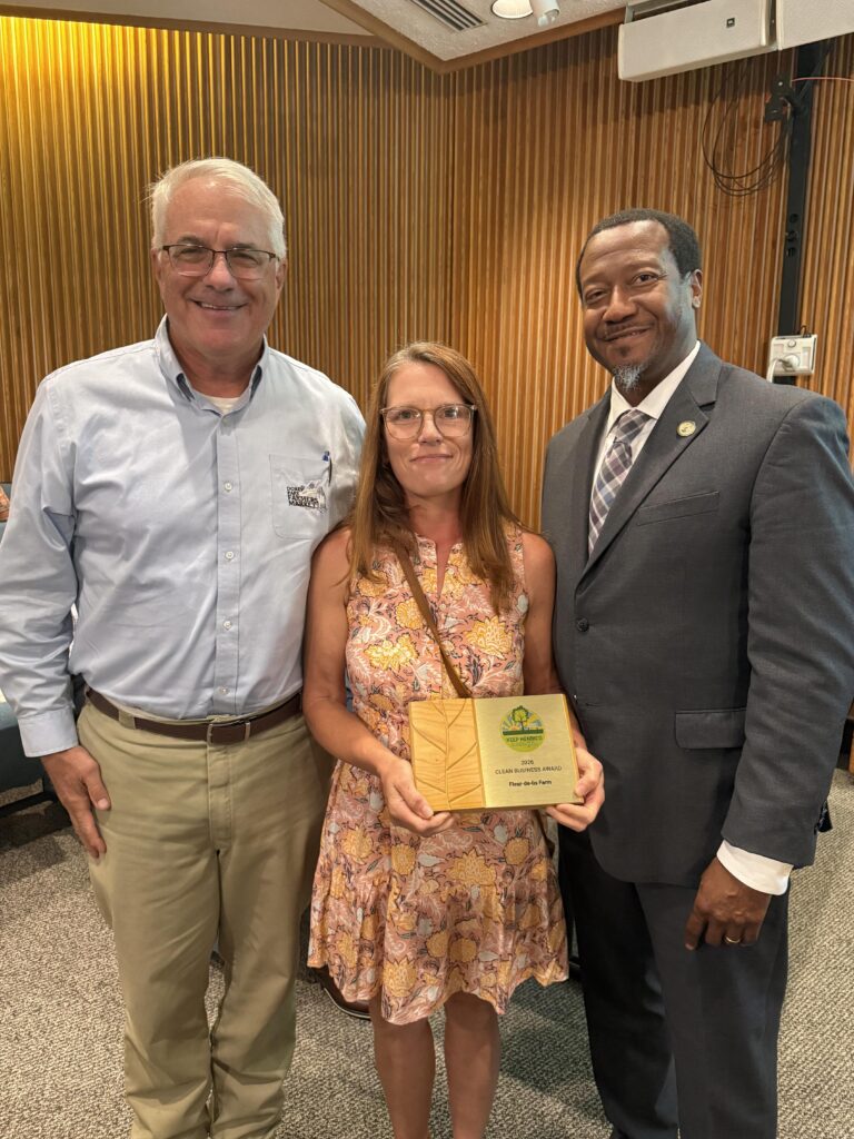 Varina Supervisor Tyrone Nelson is shown with owners of Fleur-de-lis Farms, who won the 2026 Clean Business Award for their property in the Varina District.