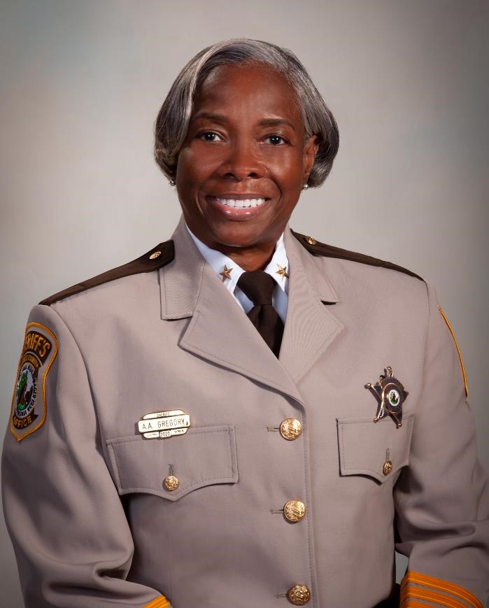 woman in uniform smiling