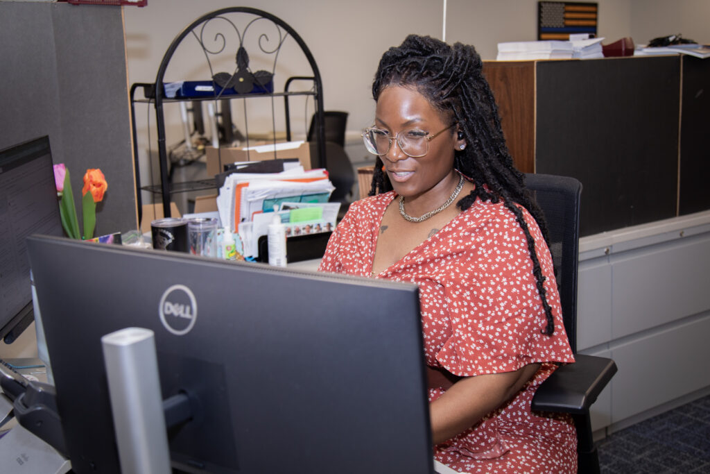 Henrico County Sheriff's Office Civil Processing Employee at a computer.