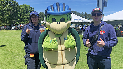 Stewart the turtle with two members of Henrico Fire.
