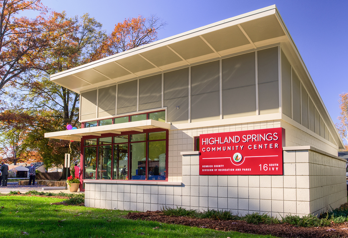 Photo of the Highland Springs Community Center building. White building with windows and a red sign on the front.