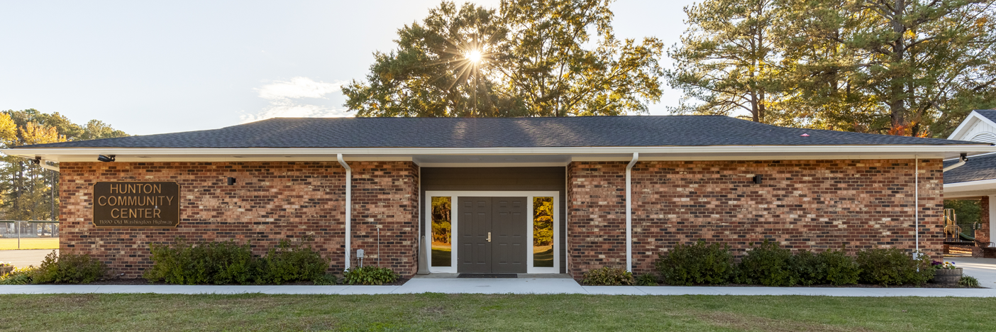 Exterior of Hunton Community Center, a brick building with double doors in the center.