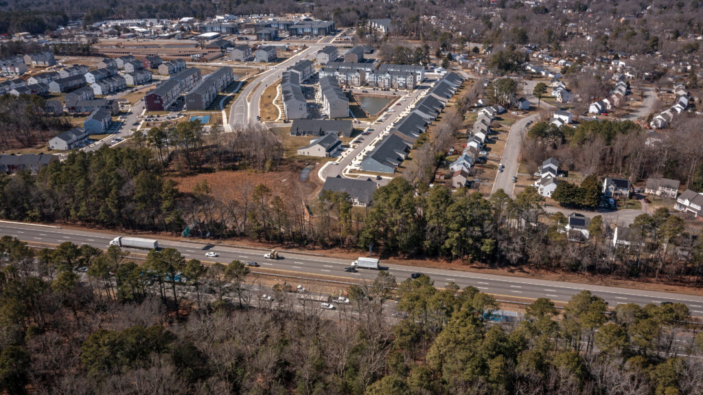 Aerial photo of a housing development and highway
