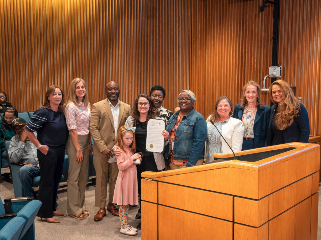 Cari Tretina and members of the community accept the Economic Development Week proclamation.