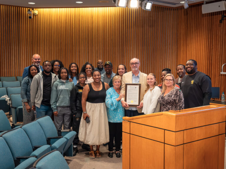 Coach Harris and his family and team at the board meeting recognizing his retirement.