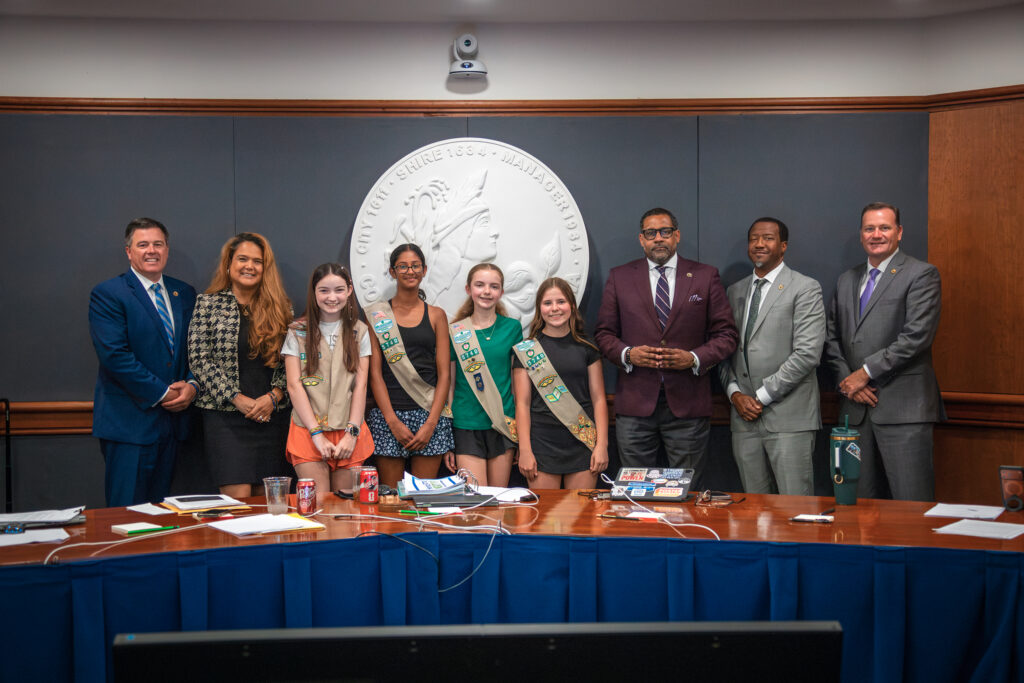 Members of Girl Scouts Troop 5740 pose with the Board of Supervisors at the work session.