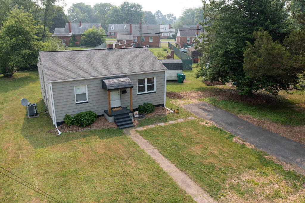 aerial photo of a house with a well-kempt front yard