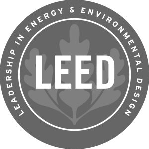 Leadership in Energy and Environmental Design (LEED) logo; the logo has an image of three tree leaves behind the word "LEED" with the name of LEED written out in a semicircle around the leaves