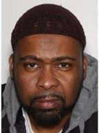Image shows a Black male, with a knitted cap on and a sweatshirt.