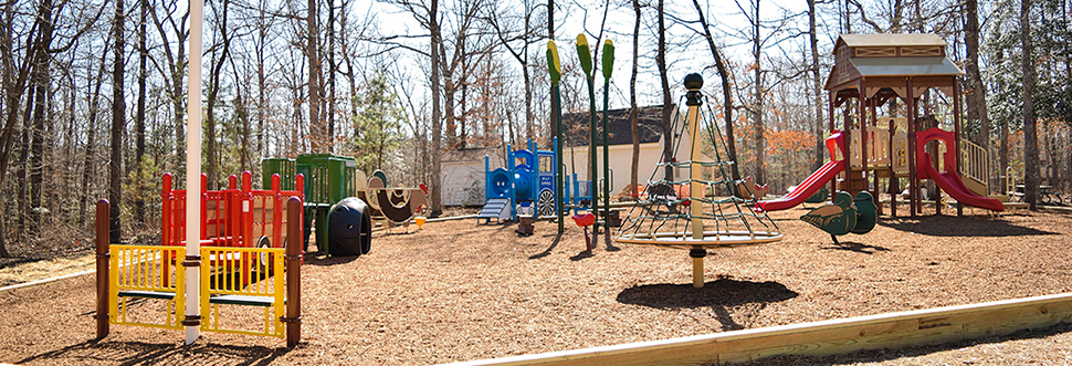 A variety of the equipment at the Crump Park playground, all farm-themed