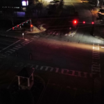 Intersection of Nuckols and Twin Hickory before the installation of solar lights. At this angle some of the road can be seen, but largely due to headlights from a car at the traffic light.