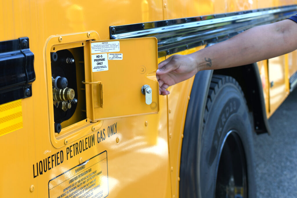 A photo shows a school bus with a propane fuel inlet.