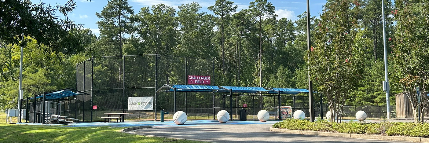 Challenger field, view of spectator seating an backstop.