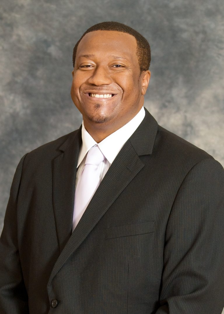A headshot photograph of Tyrone E. Nelson