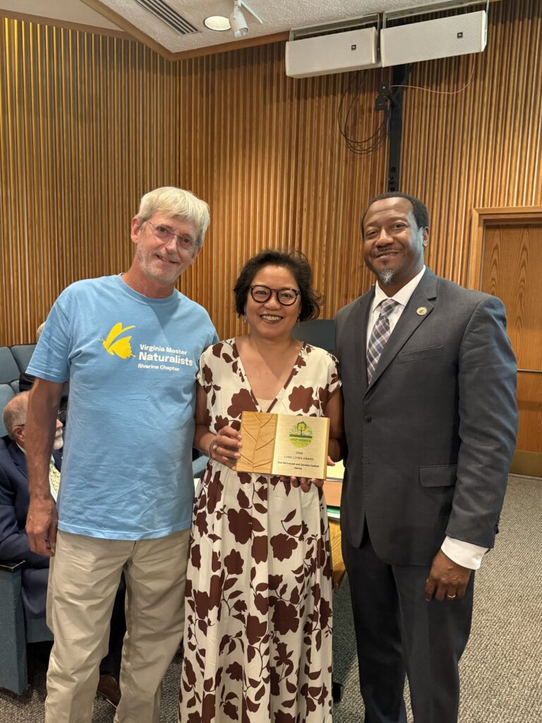 Varina Supervisor Tyrone Nelson is shown with Rob Whitehead and Cornelia Corbett. The couple won a 2026 Land Lover Award for their property in the Varina District.