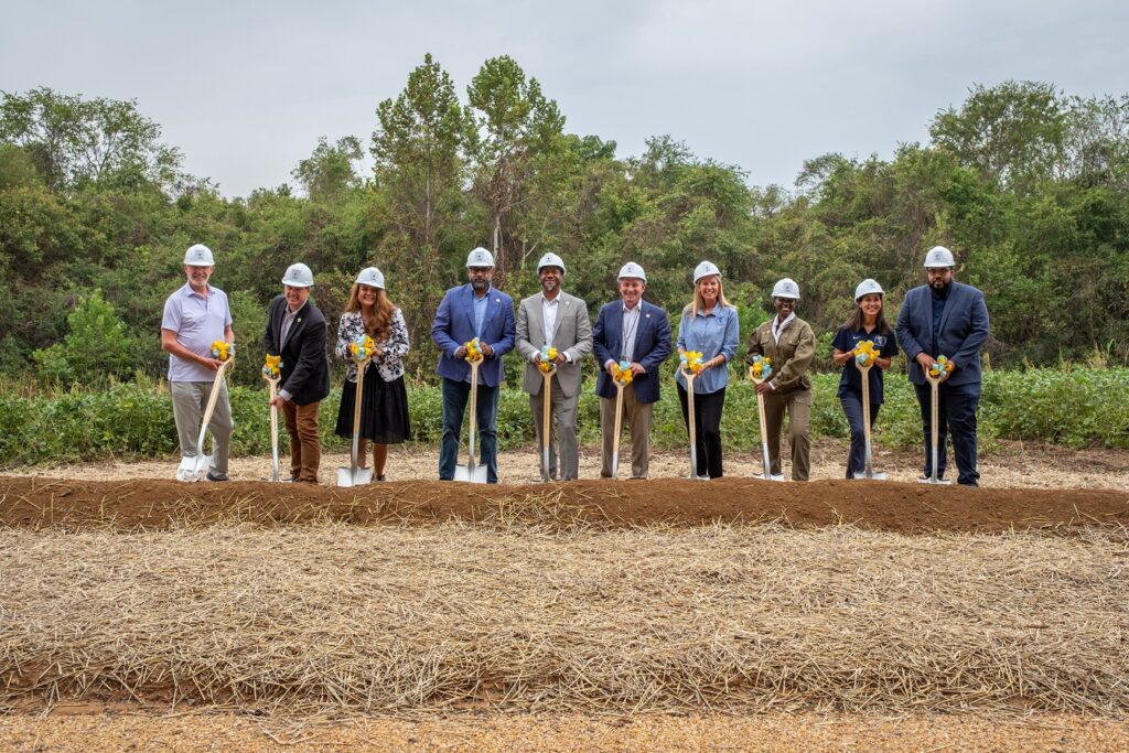 Officials prepare for a groundbreaking ceremony at Wilton Farm.