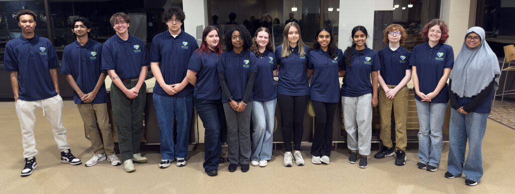 Group of students posing in a line.