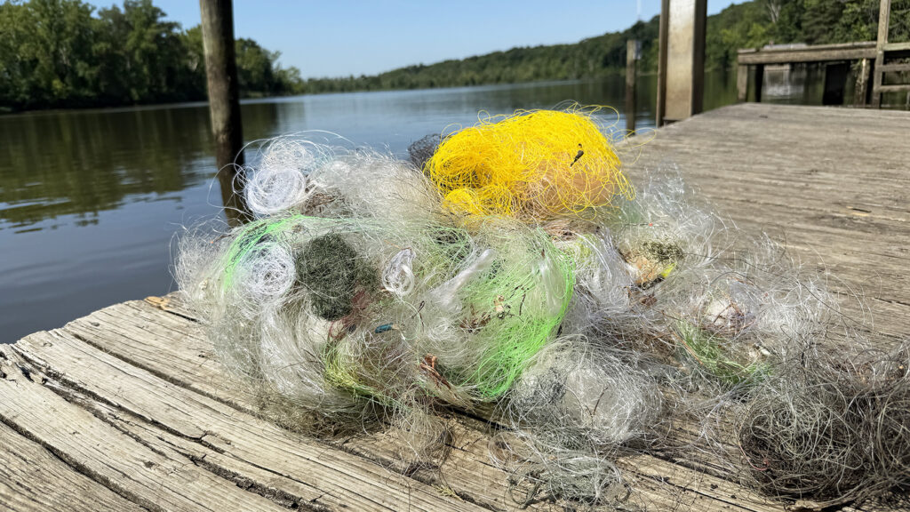 Old fishing line piled up on a dock next to the James River.