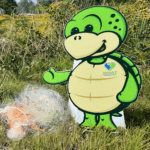 Turtle character next to pile of used fishing line.