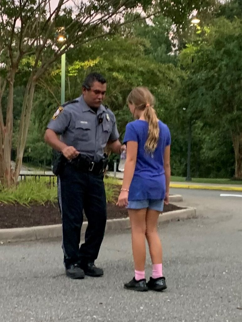 Image: Officer teaching and a youth how to salsa