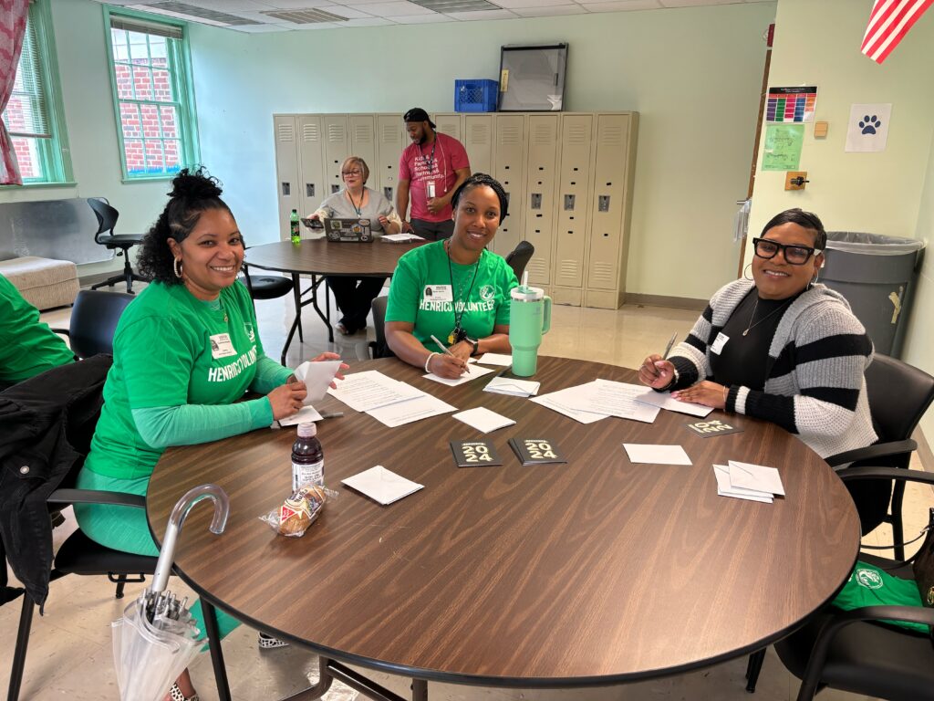 Volunteers sitting at a table